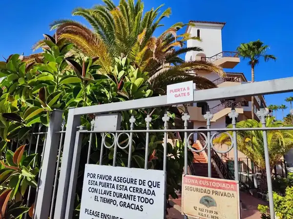 Parque Albatros resort gate 5 with security notice and access control sign, Golf del Sur, Tenerife