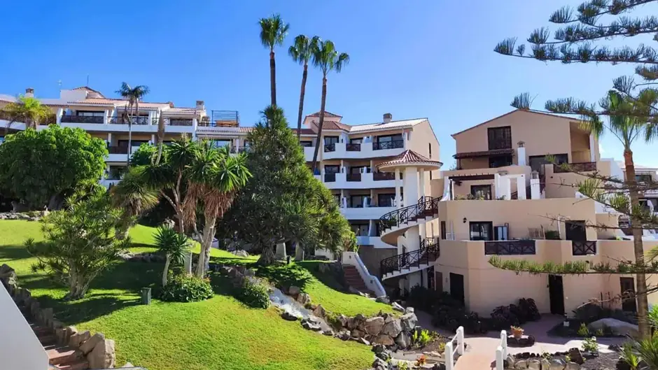 Resort with gardens under clear blue sky