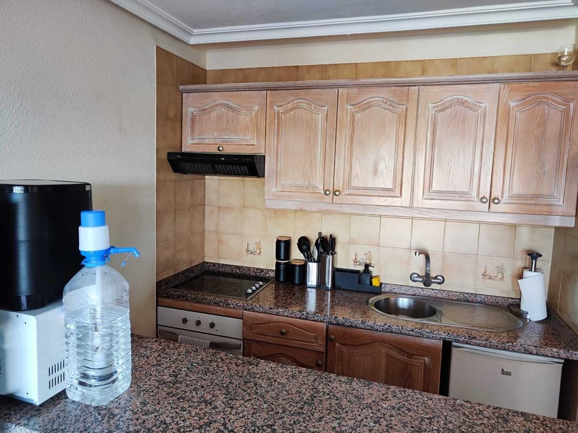 park-albatros-listing-01 Modern kitchen with wooden cabinets and appliances