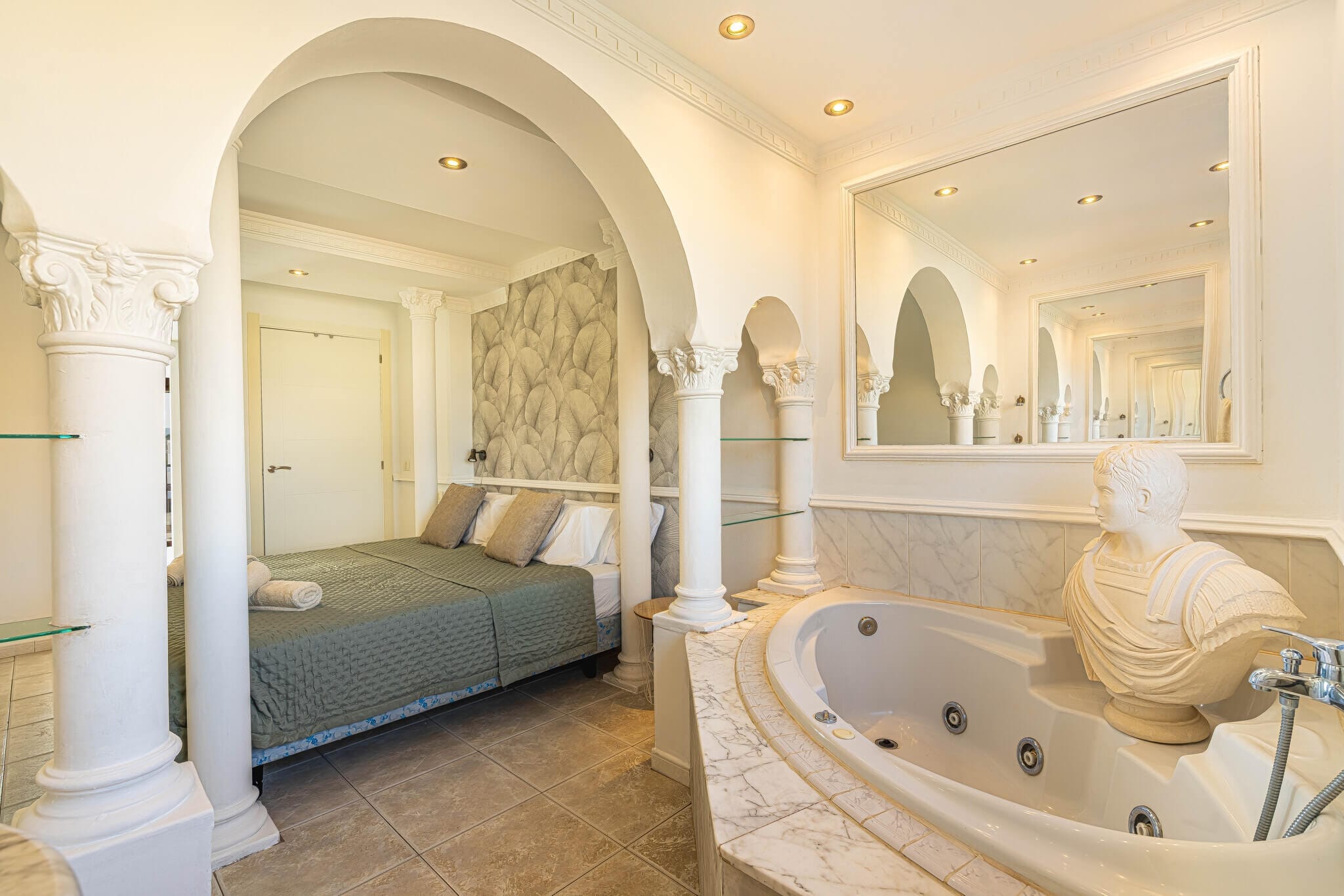 39 Luxurious bathroom with jacuzzi and elegant decor.