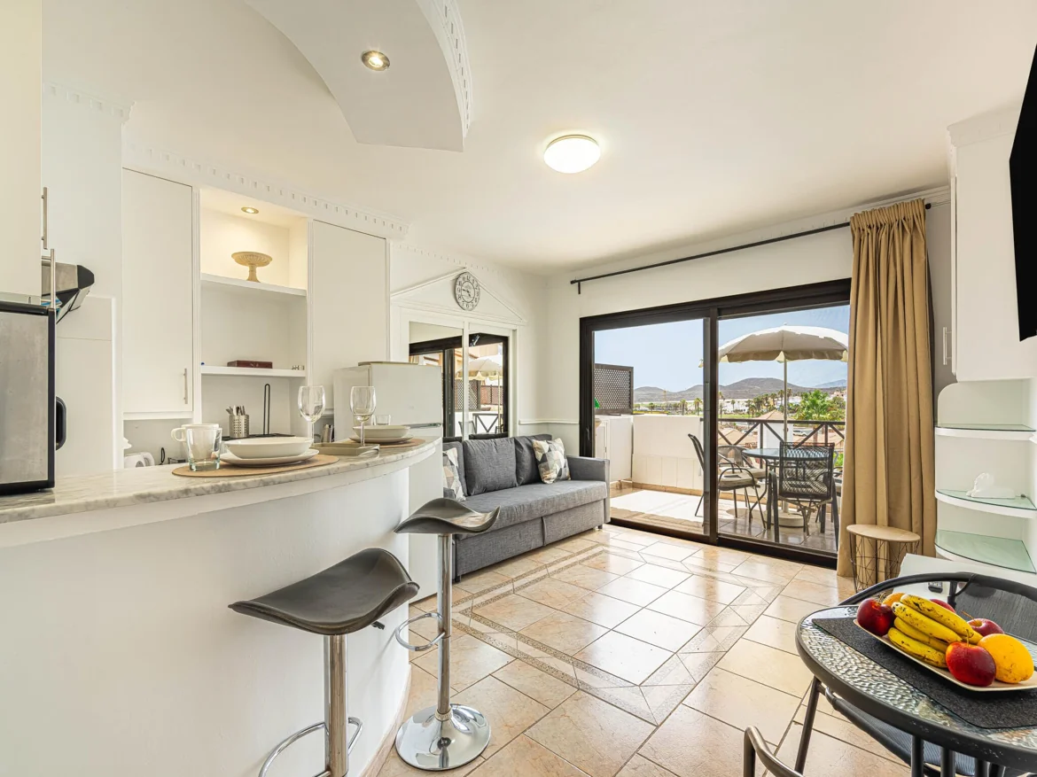 Modern apartment with kitchen, living area, and balcony view.