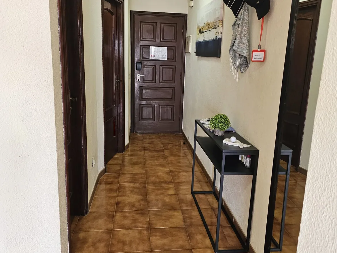 Hallway with tiled floor and modern console table