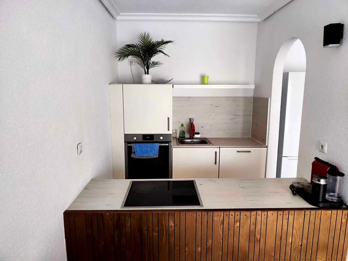 Modern kitchen with stove, oven, and sink