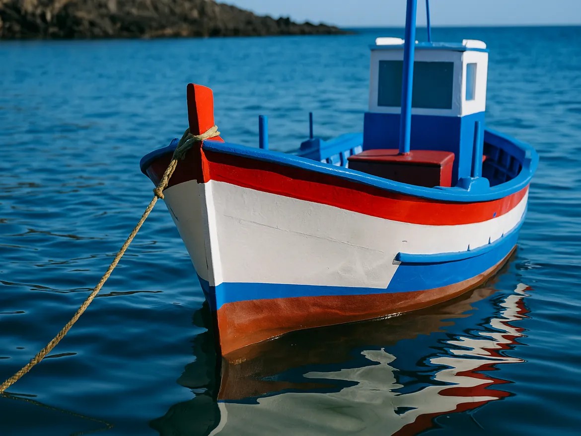 Colorful fishing boat floating on calm sea