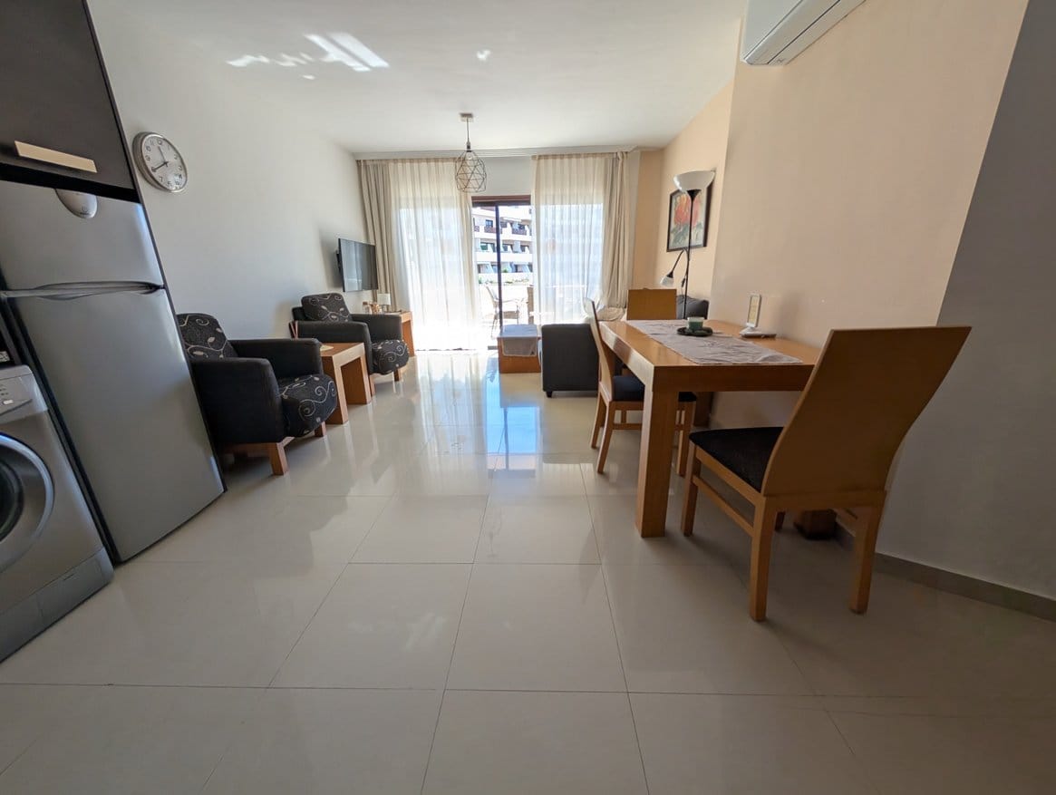 salon 2 optimized Modern living room with dining area and balcony view.